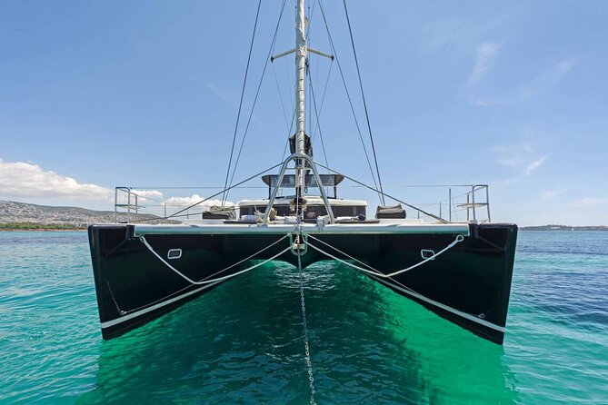 5 Hour Private Day or Sunset Cruise in Large & Majestic Catamaran - Leaving Ornos Bay by tender boat