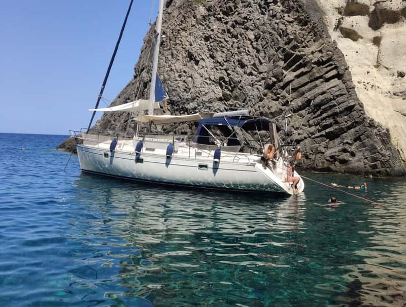 Adamantas: Kleftiko Sailing Cruise with Meal and Swim Stops - Leaving Adamantas and meeting Milos from the sea