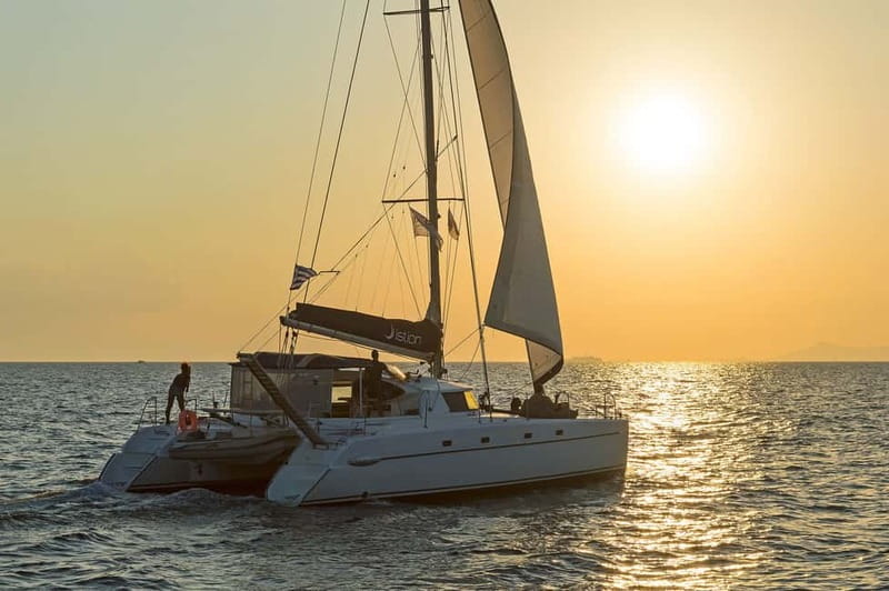 Athens: Half-Day Sunset Catamaran Cruise with Meal & Drinks - The swimming stops in clear coastal water