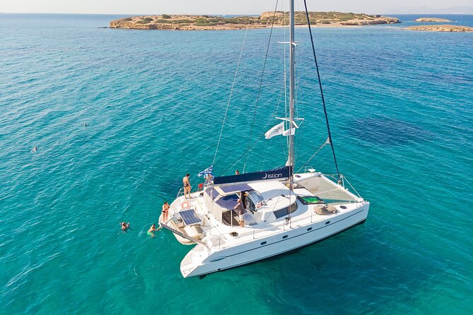 Athens Semi Private Sunset Catamaran Cruise with meal & drinks - Vouliagmeni: the first clear-water stop