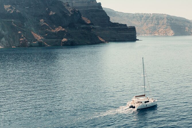 Beautiful Day Catamaran Caldera Cruise incl. Meal & Drinks - Indian Rock, the lighthouse, and the Red Beach stop