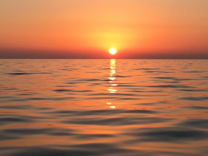 Catamaran Afternoon Cruise: Kleftiko half day with sunset - Sunset among Milos’s traditional fishing villages