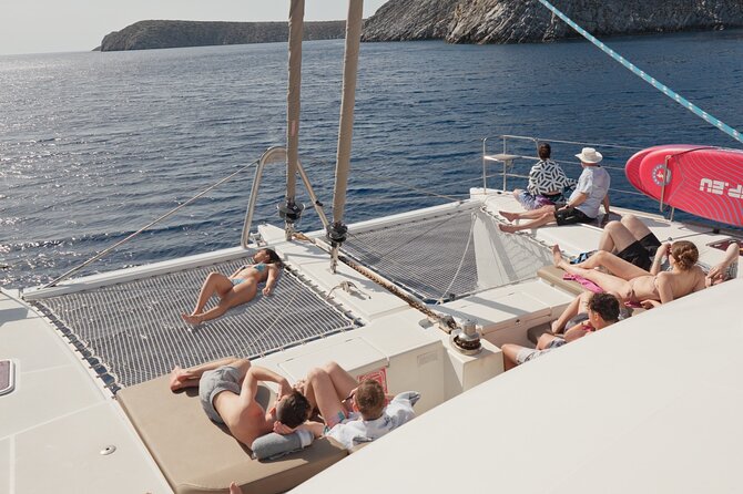 Catamaran Cruise to Dia Island with Meal and Water Activities - SUP, snorkeling, fishing, and swimming