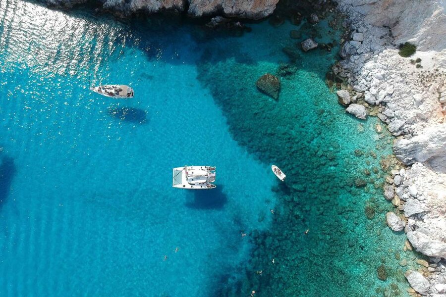 From Adamas: Milos and Poliegos Catamaran Cruise with Lunch - Kalogries offers a final swim
