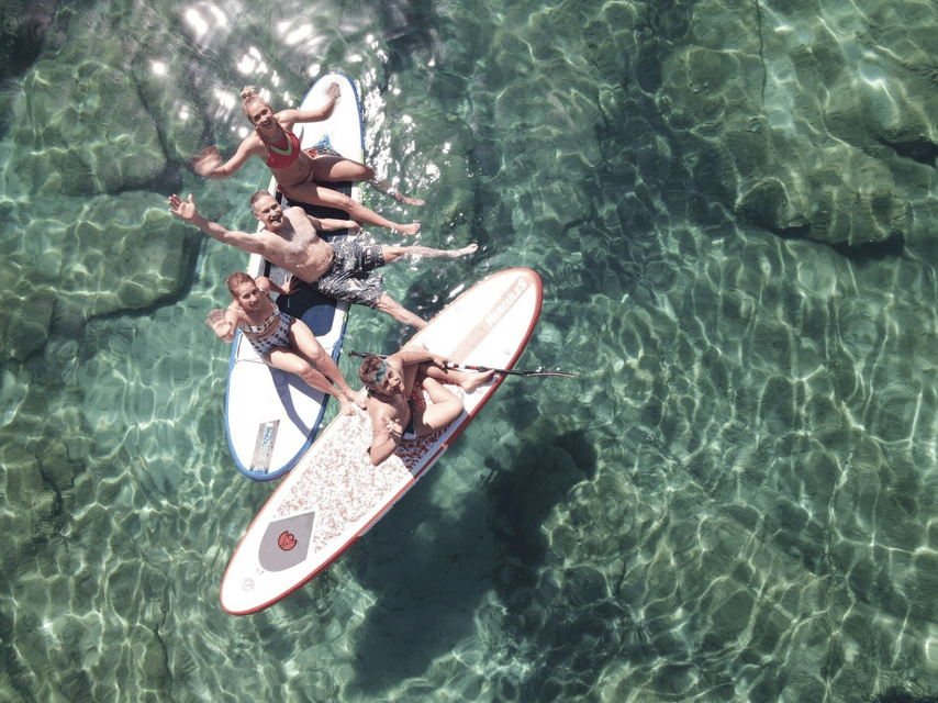 From Ornos: Mykonos Delos Catamaran Cruise with Meal & SUP - Passing Delos without visiting the ruins