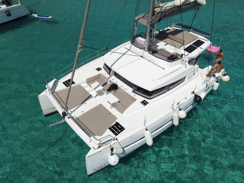 From Panormo: Private Sailing Catamaran Cruise with Lunch - The 100-minute sail toward Bali Village Bay