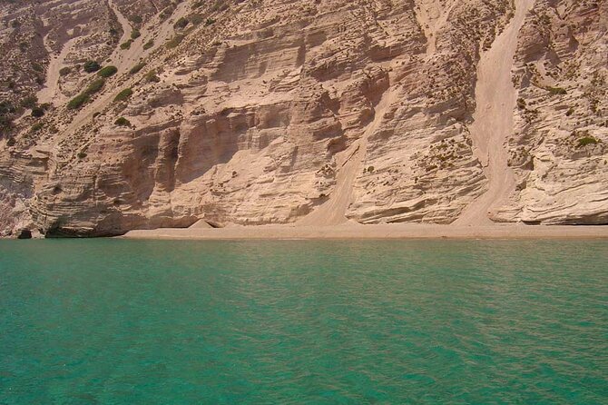 Full Day Tour to Kleftiko, Firlingos and Poliegos Catamaran - Gerakas shows Milos in white and green