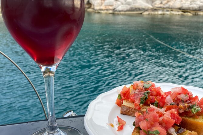 Greek Gastronomy & Wine Pairing Cruise with a Sommelier in Athens - Yiannis and the crew set the tone