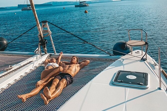 Half-Day Exclusive Catamaran Cruise in Santorini with Meal and Open Bar - Red Beach and the southern volcanic coast