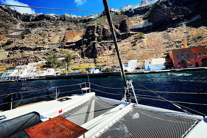 Half Day Premium Catamaran Cruise in Santorini including Oia - Limestone formations and clear water