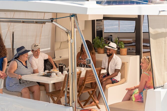 Hersonissos: Luxury Sunset Catamaran Cruise Sushi & Open Bar - The cliffs, chapel, and Cave of Saint George