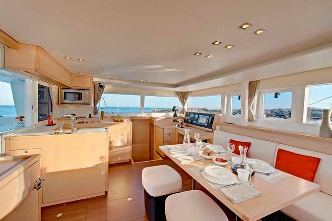 Island Hopping: Santorini Catamaran Charter Cruise with a skipper - Service from the skipper and hostess