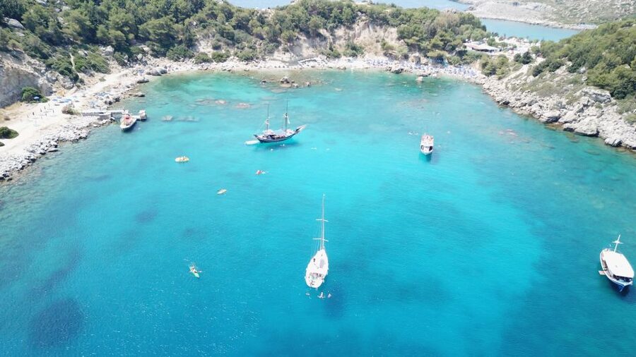 Lindos: Full-Day Private Sailing Cruise - Red Sand Beach, your first swim stop