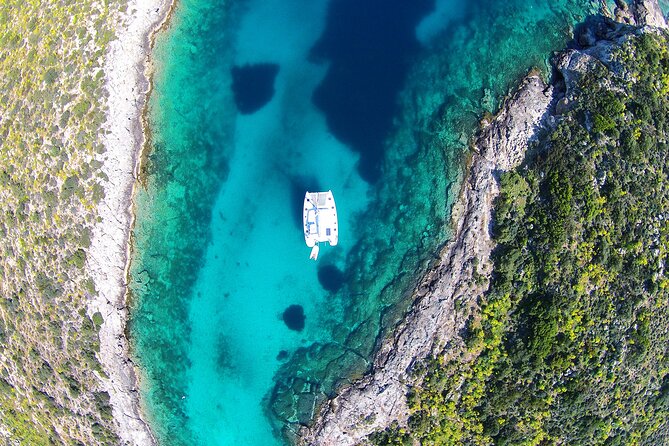 Luxury Catamaran Cruise Including pickup and Traditional Food - A Greek lunch with shrimp saganaki and BBQ
