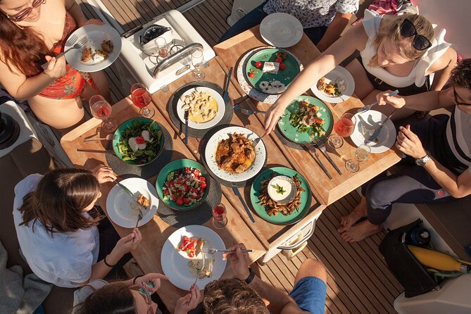 Luxury Catamaran Sunset Private & Greek Gastronomy in Athens - Vouliagmeni Beach and the main Greek meal