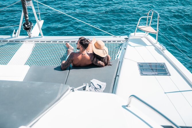 Majestic Catamaran Caldera Cruise with Snacks, Meal & Drinks - Red Beach from the water