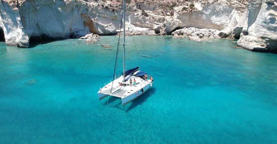 Milos: Full-Day Catamaran Cruise with Paddle Board - Leaving Adamantas with Milos opening up around you