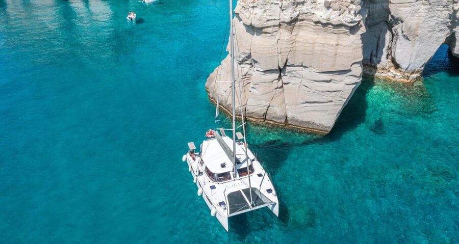Milos: Kleftiko Morning Catamaran Cruise with Lunch & Drinks - Klima: Milos fishing houses viewed from the water