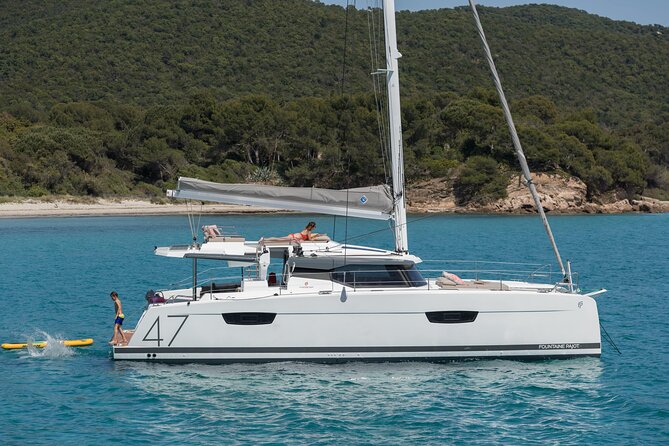 Mykonos: Brand-New Catamaran Cruise with Meal, Drinks & Transport - Rhenia’s quiet waters and the Mykonian south coast