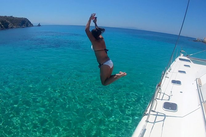 Mykonos Catamaran Private Sunset Cruise, Full Meal & Open-Bar - Leaving Ornos Bay by tender boat