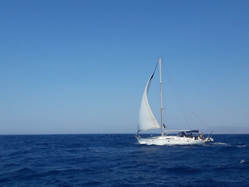 Mykonos: Delos and Rhenia Full-Day Sailing Cruise with Meal - Rhenia’s Clear Water and Quiet Bays