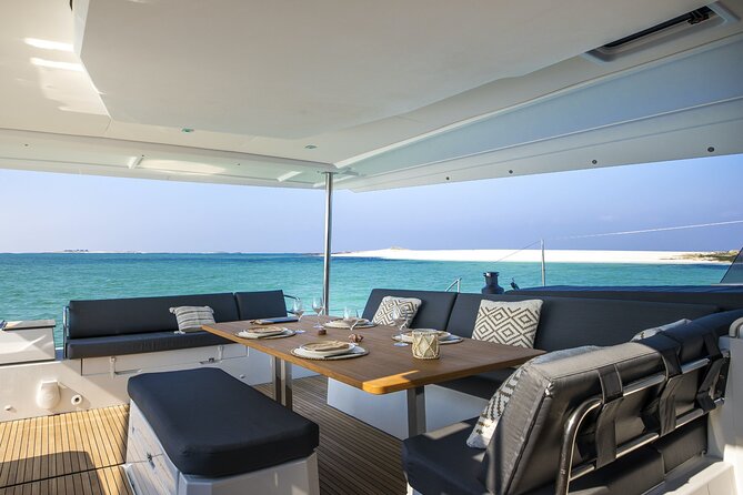 Mykonos: Luxury Catamaran Cruise with Meal, Drinks & Transport - Swimming, snorkeling, SUP, and kayak time