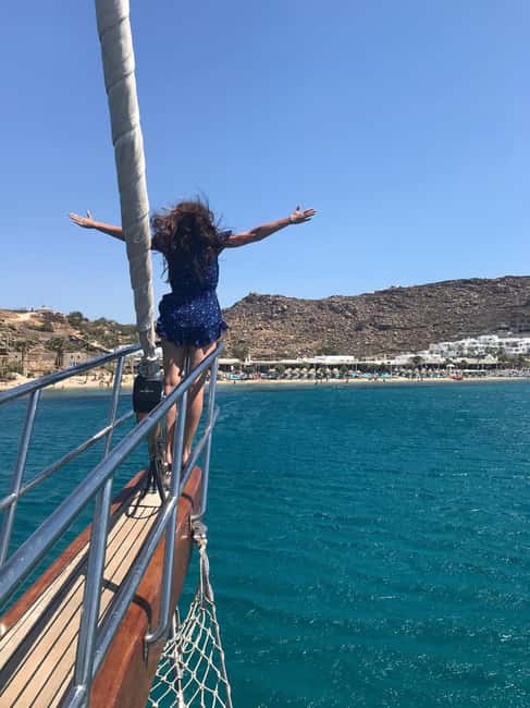 Mykonos: Sunset Sail Cruise to Rhenia, Beach Hopping, Dinner - Boarding, safety, and the changing meeting point