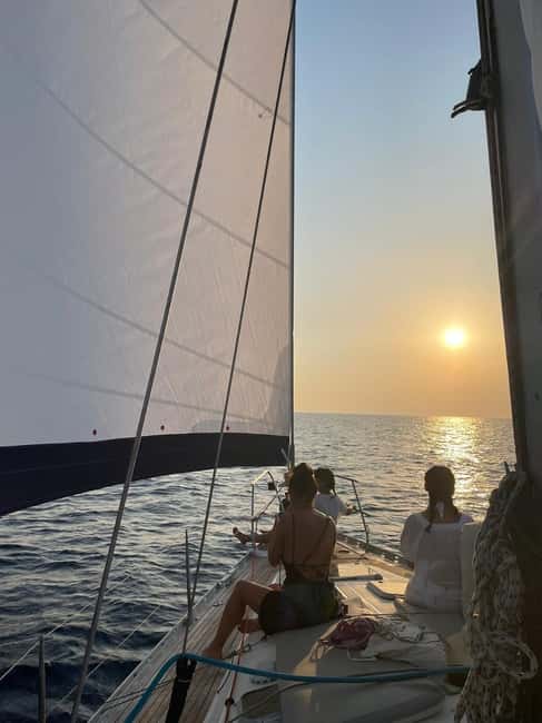Mykonos: Sunset Sail Cruise to Rhenia, Beach Hopping, Dinner - The sunset return to Mykonos