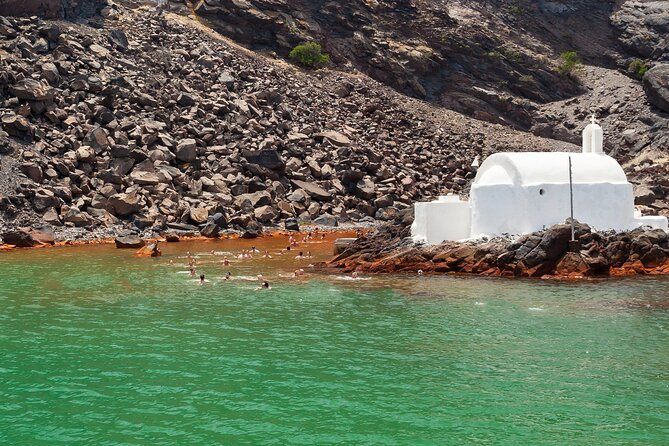 Private Full-Day Motor Yacht Cruise with Meal, Open Bar+Transfers - Red Beach and White Beach: Santorini’s colorful shoreline