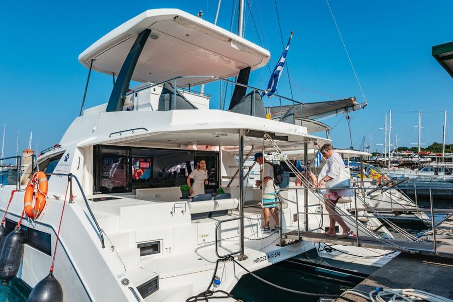 Rhodes: Sunset Catamaran Cruise with Dinner Buffet & Drinks - Leaving Mandraki Harbor in the late afternoon