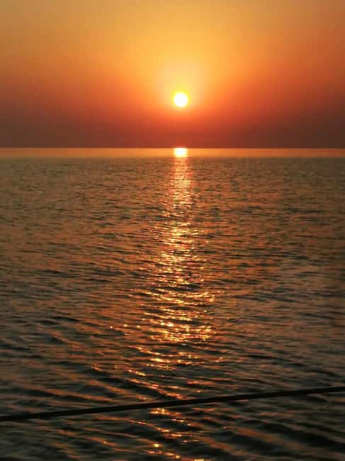 Rhodes: Sunset Catamaran Cruise with Snack, Fruits & Drinks - An hour at Kallithea Springs Bay