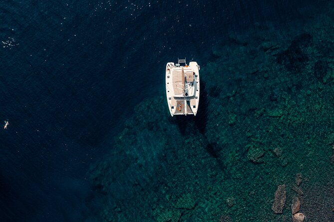 Romantic Sunset Catamaran Caldera Cruise incl. Meal & Drinks - Hotel pickup is useful, but allow extra time
