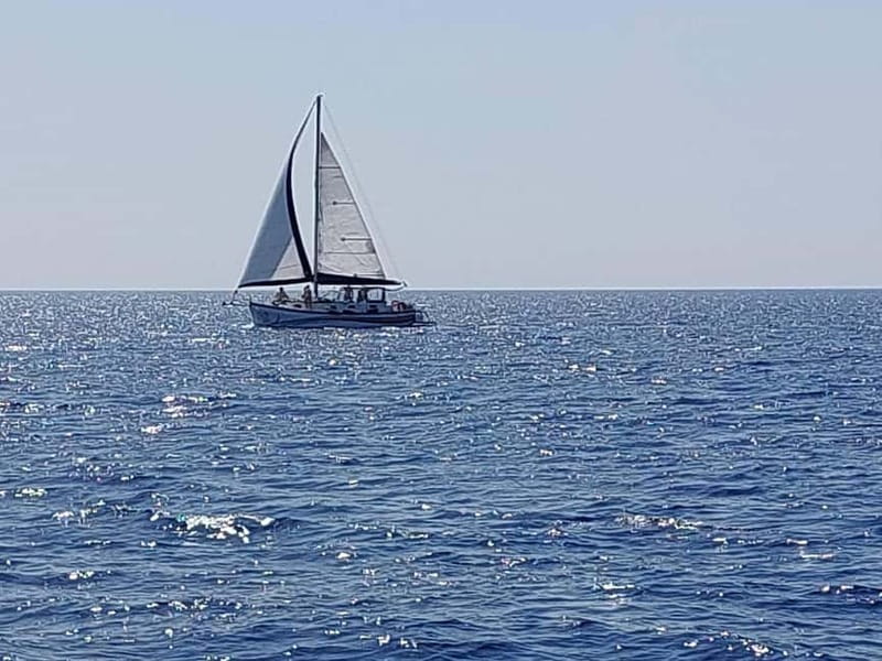 Sailing tour around Lindos with food and drinks - Red Sand and Agathi Caves: the first swim stops