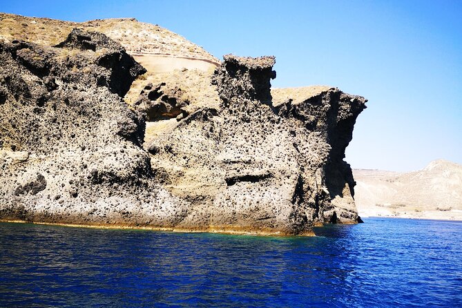 Sailsational Luxury Santorini Catamaran Sunset Cruise with Dinner - White Beach and the pale volcanic cliffs