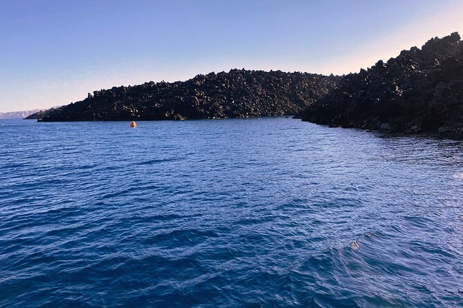 Sailsational Luxury Santorini Catamaran Sunset Cruise with Dinner - Mesa Pigadia, swimming, and dinner onboard