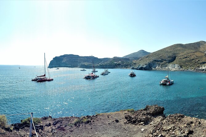 Sailsational Luxury Santorini Catamaran Sunset Cruise with Dinner - Returning through Vlychada after sunset