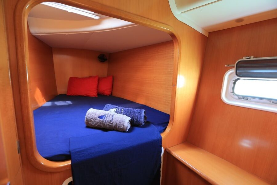 Santorini: 7-Hour Private Catamaran Cruise with Food & Drink - Oia from the water, with lunch onboard