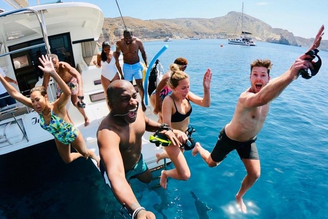 Santorini All-inclusive Catamaran Cruise with Thirassia Stop - Black Mountain, the lighthouse, and the beaches
