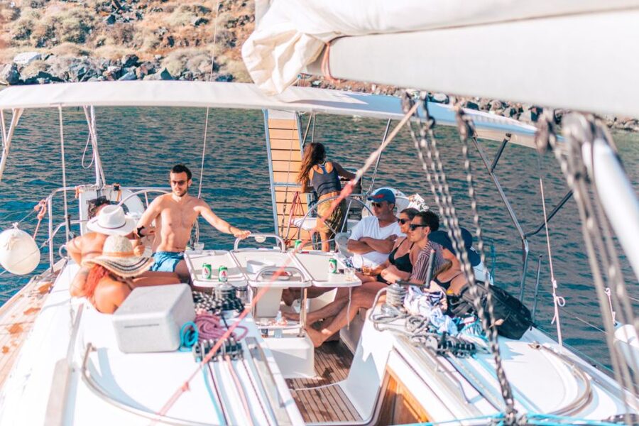 Santorini Caldera: Morning Sailing Cruise with Meal - Black, red, and white volcanic shores
