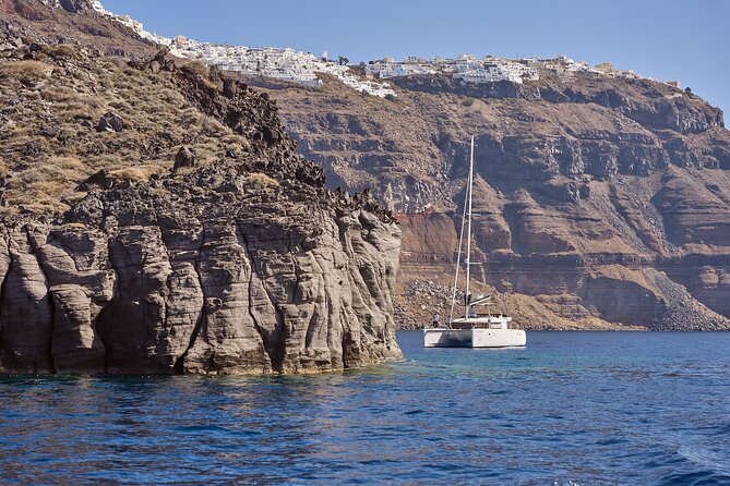 Santorini: Caldera Private Catamaran Cruise with Meal & Drinks - White Beach is a boat-only coastal stop