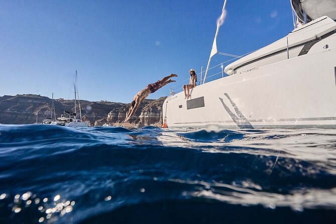 Santorini: Caldera Private Catamaran Cruise with Meal & Drinks - Nea Kameni brings volcanic scenery and lunch
