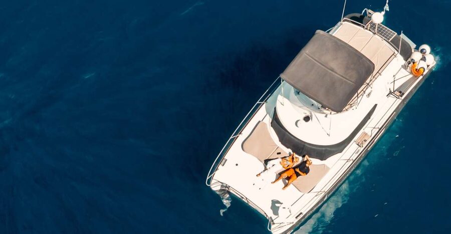 Santorini: Caldera Private Power Catamaran Cruise - From Thera to Ammoudi Bay