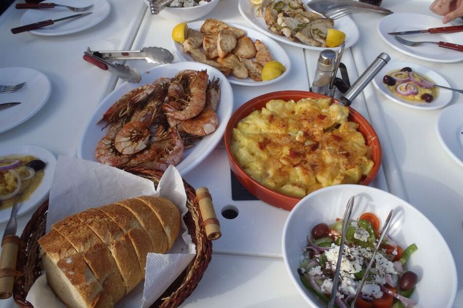 Santorini Caldera: Sunset Sailing Cruise with Meal - Akrotiri Lighthouse and the sails inside the caldera
