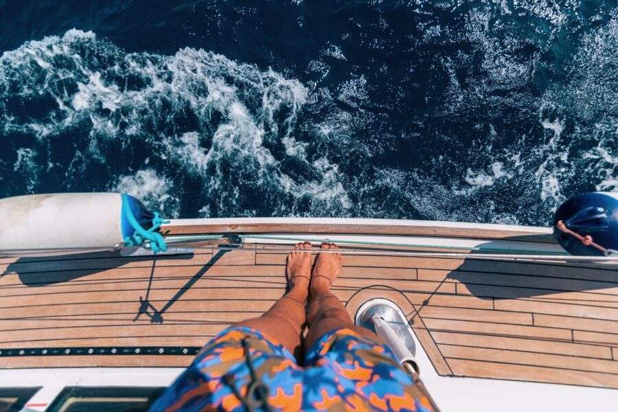 Santorini Caldera: Sunset Sailing Cruise with Meal - Palea Kameni, warm water, and volcanic shores