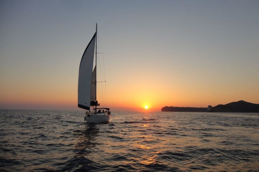 Santorini Caldera: Sunset Sailing Cruise with Meal - Red Beach and White Beach from the water