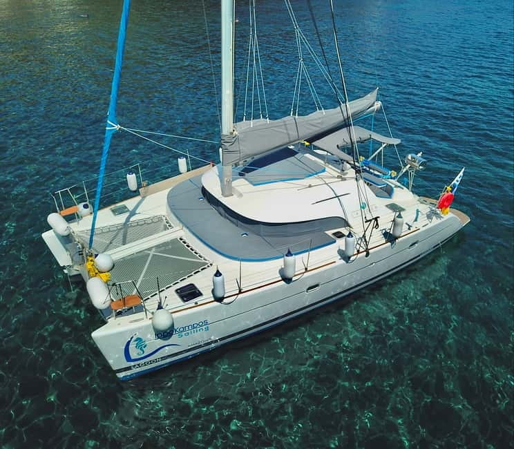 Santorini: Catamaran Cruise with Food and Drinks - Red Beach and the first swim