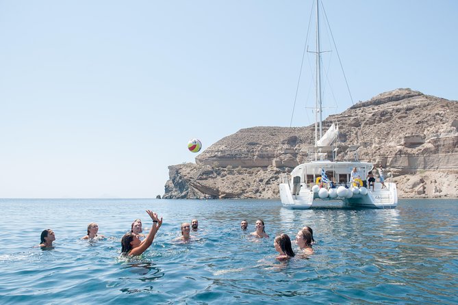 Santorini Catamaran Cruise with Fresh Meal and Open Bar - White Beach and the Akrotiri coast