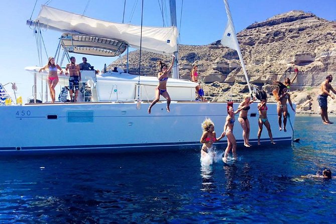 Santorini Catamaran Cruise with Fresh Meal and Open Bar - Local wine, beer, and the sunset option