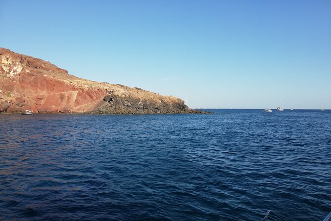 Santorini Catamaran Cruise with Fresh Meal and Open Bar - A small boat with room to move