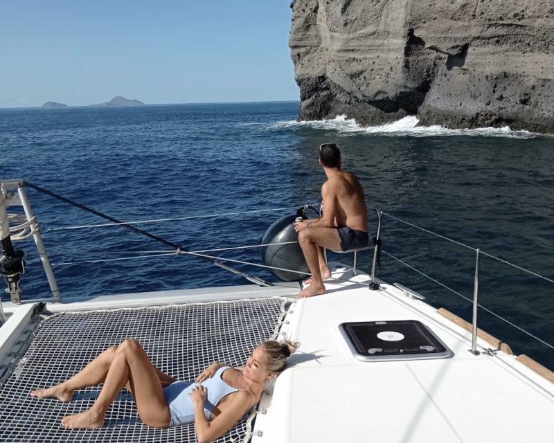 Santorini: Catamaran Cruise with Lunch, Drinks, & Oia Visit - The volcano, caldera cliffs, and Indian Rocks